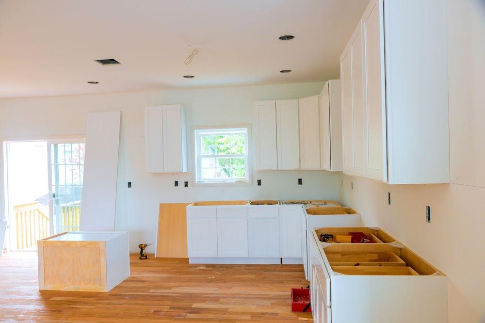 In,construction,of,new,house,,custom,kitchen,cabinets,are,installed